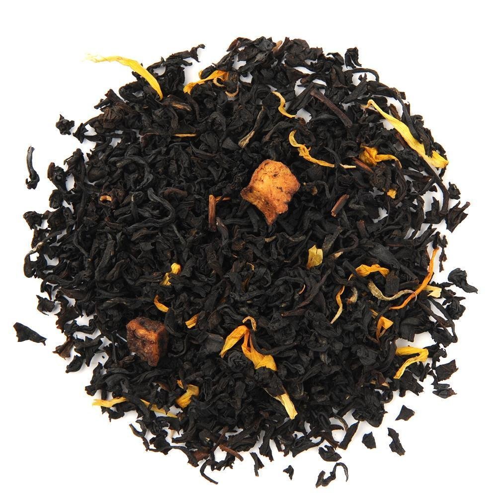 Organic Juicy Peach Black Tea loose leaf blend with dried peach bits and marigold petals, offering a sweet, fruity flavor.