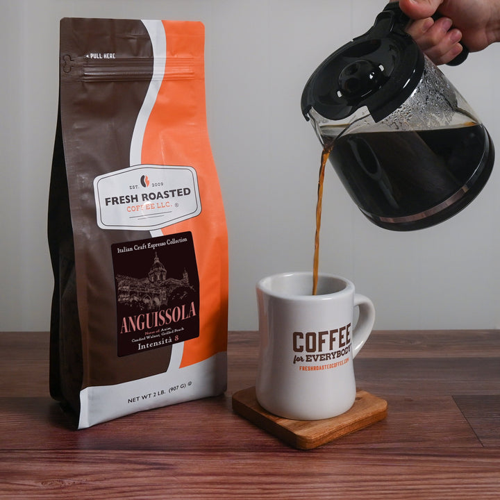 Brewed Fresh Roasted Coffee Anguissola espresso being poured into a white coffee mug, rich and aromatic blend.