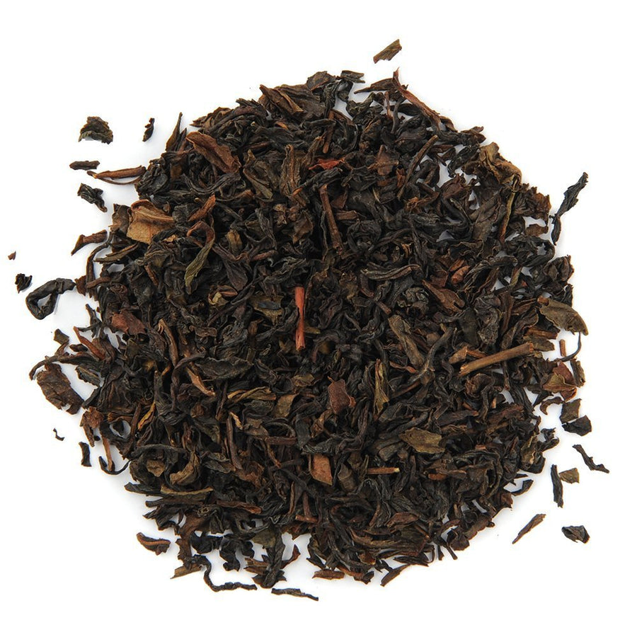 Positively Tea Company Organic Darjeeling loose leaf black tea, showcasing its rich color and delicate, aromatic leaves.