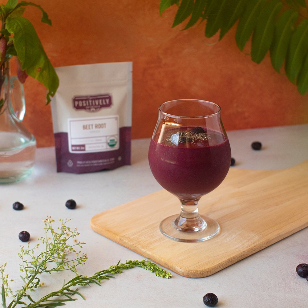 Positively Botanicals Organic Beet Root powder blended into a smoothie, delivering natural color and earthy sweetness.